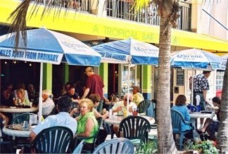 Street side tables at Cha Cha Coconuts on St Armands Circle Sarasota Florida 